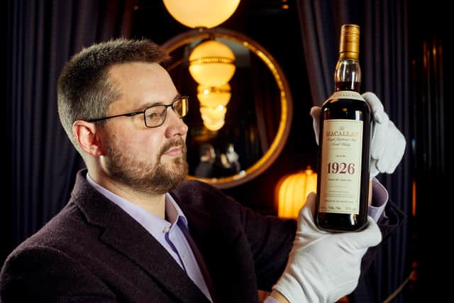 Whisky auctioneer founder Iain Mcclune with the 'Holy Grail' Macallan