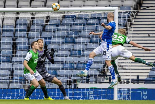 St Johnstone's Shaun Rooney heads home past Hibernian's Matt Macey to make it 1-0 during the Scottish Cup final match between Hibernian and St Johnstone at Hampden Park, on May 22, 2021, in Glasgow, Scotland. (Photo by Craig Williamson / SNS Group)