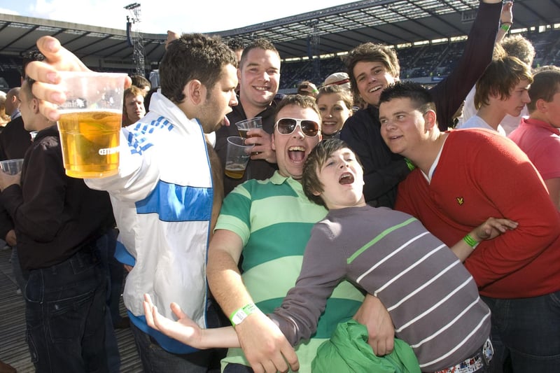 These Oasis fans are clearly enjoying themselves during the band's show at Murrayfield in 2009.