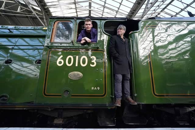 UK Poet Laureate Simon Armitage, right, in Flying Scotsman's cab at Edinburgh Waverley on Friday. Picture : Andrew Milligan/PA Wire