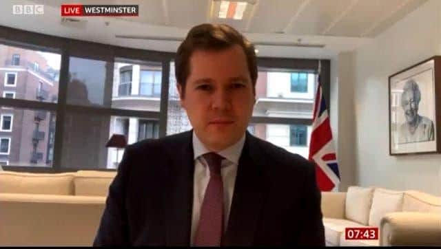 Robert Jenrick was speaking to the presenters via a video call from Westminster and the flag was seen in the background (BBC)