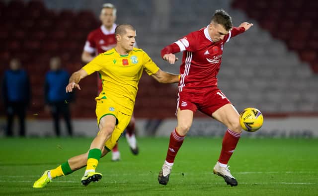 Aberdeen's Lewis Ferguson tries to escape the attentions of Hibs counterpart Alex Gogic