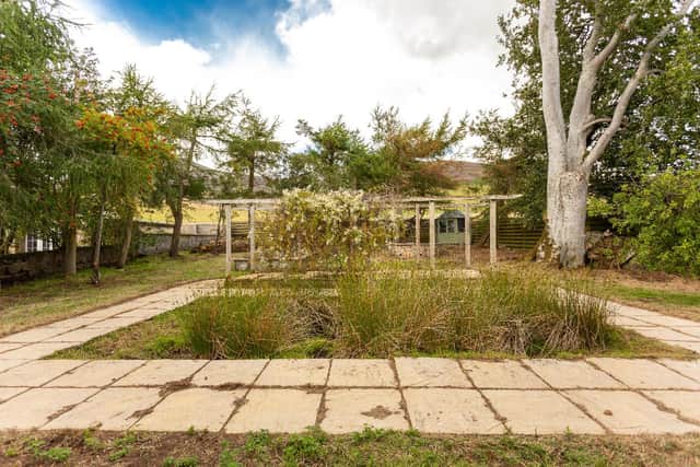There is a further area of garden with a sunken pond, pergola and sun house.