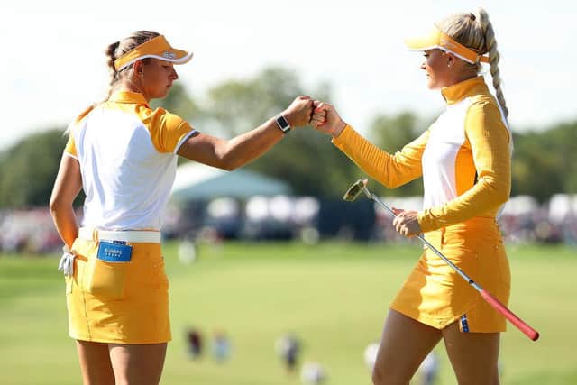 Emily Kristine Pedersen and Charley Hull first bump their during their afternoon win on the second day. Picture: Maddie Meyer/Getty Images.