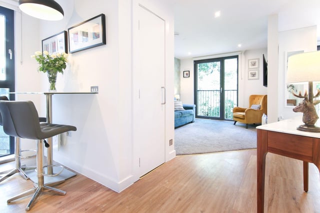 The flat's open plan reception area branches into all rooms of the flat.