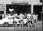 Teens stripped to the waist and in bare feet crossing Princes Street in summer 1976.