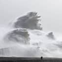 Waves crash over Newhaven harbour in East Sussex today. Picture: Glyn Kirk/AFP via Getty Images
