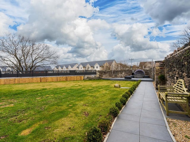 A large expanse of lawn enjoys hours of uninterrupted sun in the warmer months and an area of timber decking offers the perfect spot to enjoy alfresco eating and drinking in the warmer months.