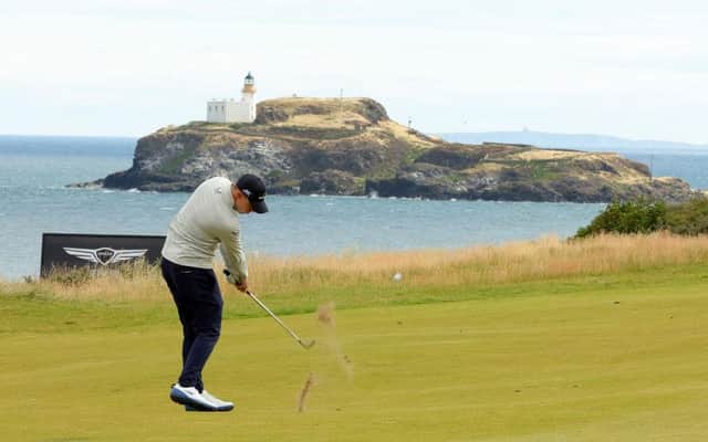 Matt Fitzpatrick  plays their second shot on the 13th hole in the second round of the Genesis Scottish Open at The Renaissance Club. Picture: Kevin C. Cox/Getty Images.