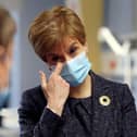 Watching footage of the first person in the UK to receive the Pfizer coronavirus vaccine gave First Minister Nicola Sturgeon a “lump in the throat”, she has said. (Photo by Russell Cheyne - Pool/Getty Images)