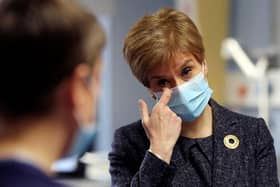 Watching footage of the first person in the UK to receive the Pfizer coronavirus vaccine gave First Minister Nicola Sturgeon a “lump in the throat”, she has said. (Photo by Russell Cheyne - Pool/Getty Images)