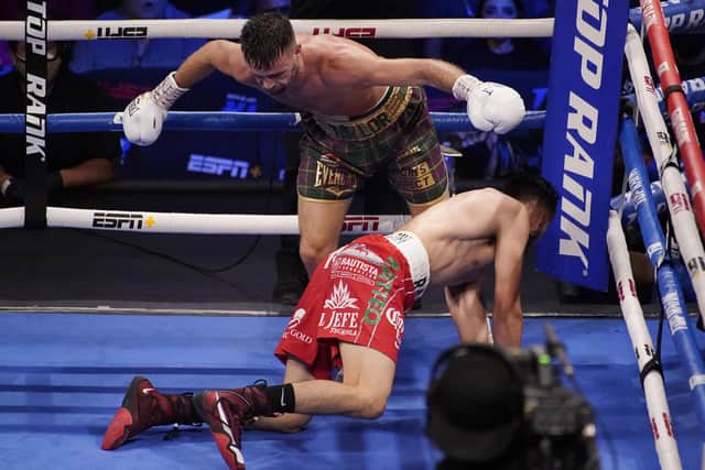 Josh Taylor knocks down Jose Ramirez in Las Vegas. Picture: John Locher/AP
