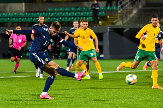 Shooting for goal against Lithuania on international duty with Scotland Under-21s