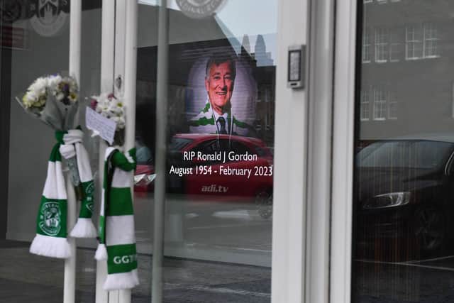 Tributes are placed outside Easter Road following the passing of Ron Gordon