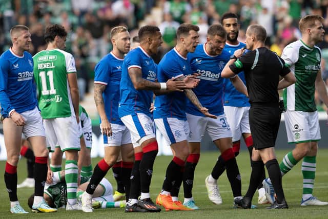 Rangers players argue with Referee Willie Collum after he produces a red card for John Lundstram for a foul on Martin Boyle. Picture: Alan Harvey / SNS