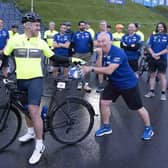 Scottish rugby legend Kenny Logan (on bike) and Ally McCoist (right) prepare to set off from Murrayfield with a team of celebrities on a 700 mile endurance challenge from Edinburgh to Paris to raise money for the charity set up by the late Doddie Weir.