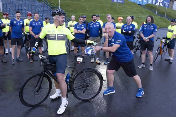 Scottish rugby legend Kenny Logan (on bike) and Ally McCoist (right) prepare to set off from Murrayfield with a team of celebrities on a 700 mile endurance challenge from Edinburgh to Paris to raise money for the charity set up by the late Doddie Weir.