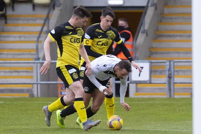 Liam Henderson (centre) goes to ground in the box but is shown a second yellow card for diving during the Scottish League One play-off final. (Photo by Mark Scates / SNS Group)