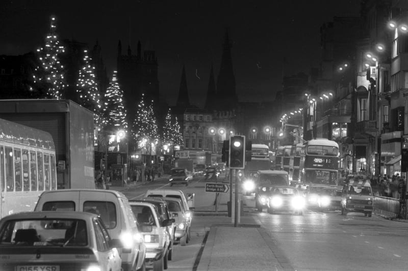 There were complaints from residents about the lack of Christmas lights and Christmas decorations in Edinburgh's Princes Street in December 1985. Picture of the Xmas trees lining the road, looking west.
