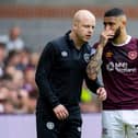 Hearts interim manager Steven Naismith speaks with Josh Ginnelly during the last game of the season against Hibs.