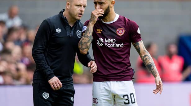 Hearts interim manager Steven Naismith speaks with Josh Ginnelly during the last game of the season against Hibs.