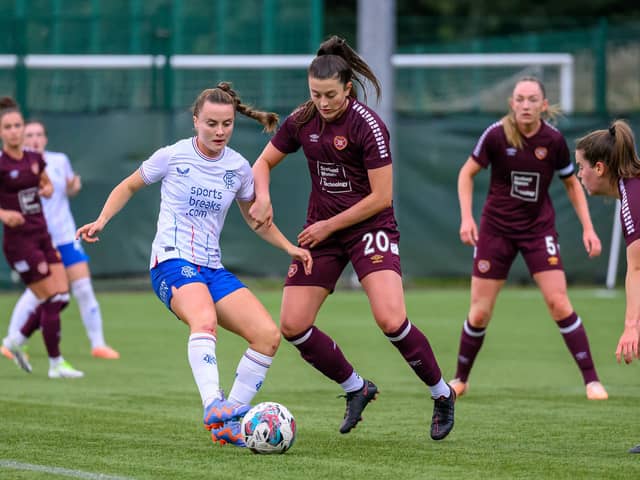 Carly Girasoli tackles Kirsty Howat in the last meeting. Credit: (© ScottishPower Women’s Premier League | Malcolm Mackenzie)