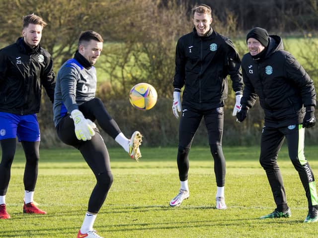 David Mitchell in Hibs training with (from left to right) Kevin Dabrowski, Matt Macey and goalkeeping coach Craig Samson in November last year. Dabrowski is the only one still at the club. Picture: SNS