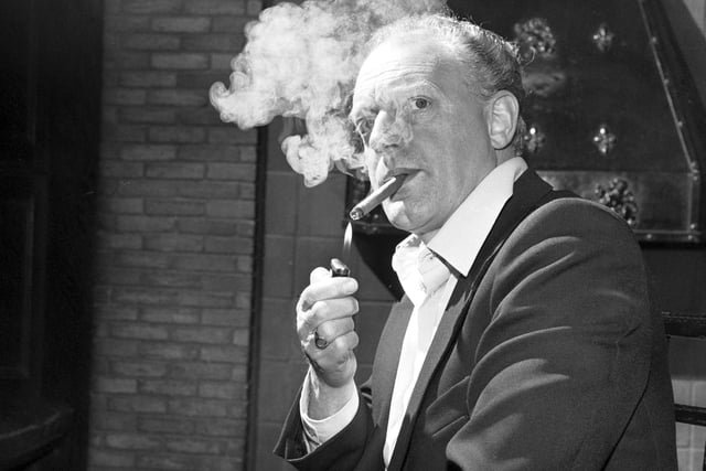 British actor Frank Windsor smoking a cigar backstage at the King's Theatre in June 1981