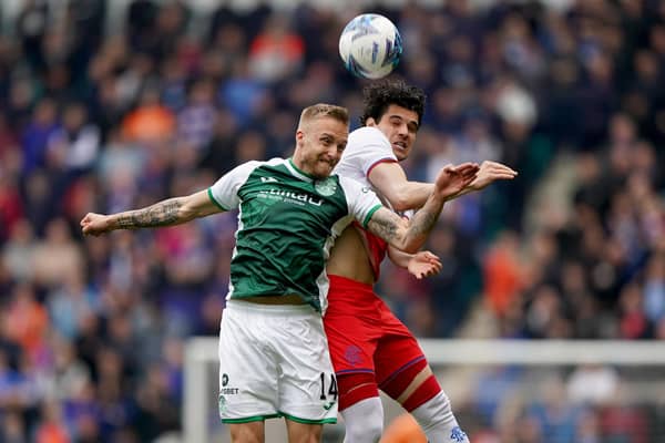 Jimmy Jeggo of Hibs challenges for an aerial ball with Rangers' Ianis Hagi during the 3-1 defeat at Easter Road on Sunday