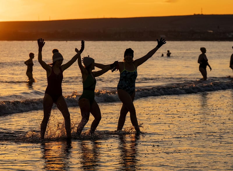 Hundreds of women took a sunrise dip in the Firth of Forth at Portobello Beach, Edinburgh, for International Women's Day.