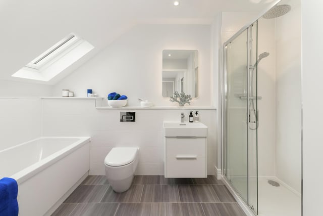 This luxurious family bathroom comes with separate bath and shower cubicle.