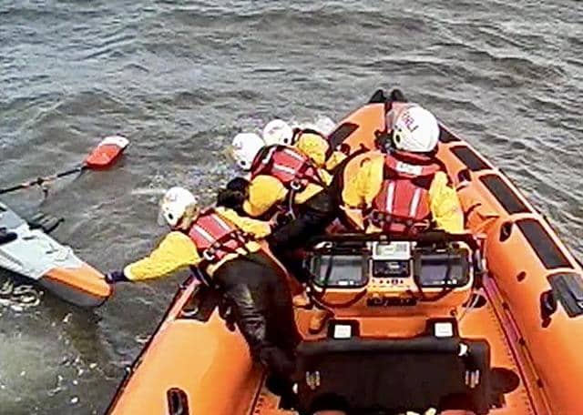 Queensferry RNLI Lifeboat rescues capsized kayaker from Firth of Forth. Credit: RNLI/Queensferry