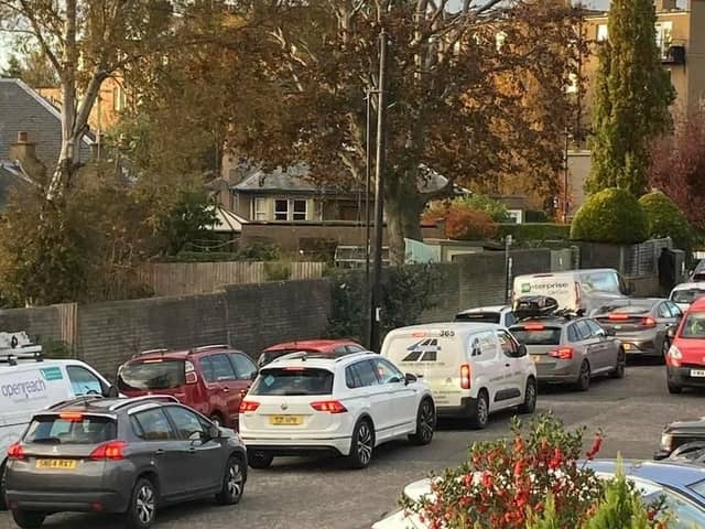 Motorists in Corstorphine queue in Station Road to turn onto St John's Road - residents say the low traffic neighbourhood has just shifted traffic from one road to another.
