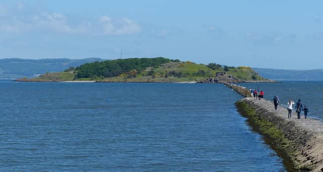 The day trippers got stuck near Cramond Island by rising water after a change in the tide . PIC: Matt Fascione/geograph.org