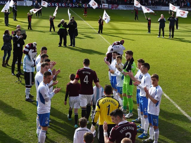 Hearts were given a guard of honour the last time they faced Queen of the South. Picture: SNS