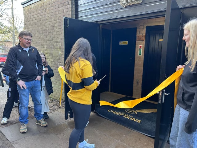 Karis Craig cuts the ribbon