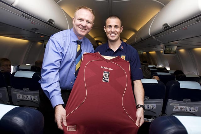 Scotland manager Alex McLeish and player Kenny Miller show off the new third Diadora kit on the plane to Georgia in October 2007. It has subtle saltire across the chest