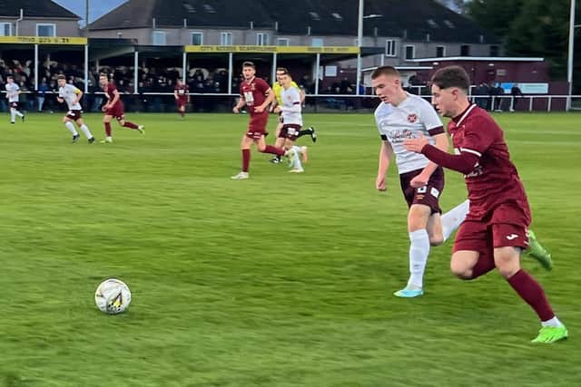 Tranent winger Adam McGowan takes on Hearts B full-back Rocco Friel. Both players both scored in an entertaining match at Forresters Park. Picture: Phil Johnson