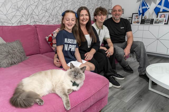 Family pet Opal decides to get in on the photocall. Pic: Michael Gillen