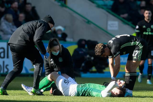 The Hibs medical team attend to Kevin Nisbet after he suffered knee ligament damage against Celtic