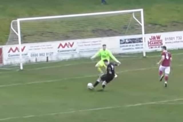 A screengrab of Cammy Leslie sliding home left-footed to complete a memorable hat-trick