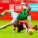 Alex Gogic in the thick of the action during a pre-season friendly between Hibs and Aberdeen at Pittodrie