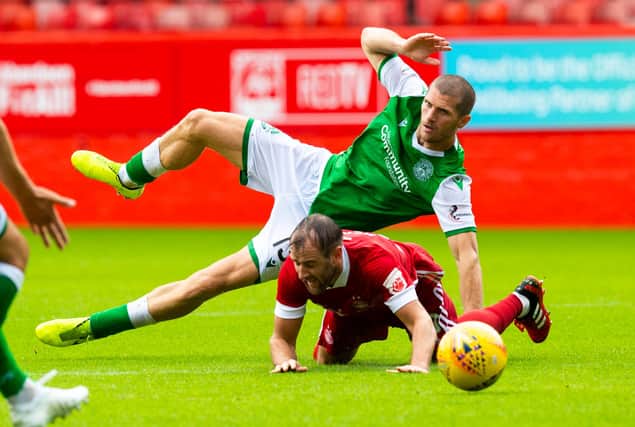 Alex Gogic in the thick of the action during a pre-season friendly between Hibs and Aberdeen at Pittodrie