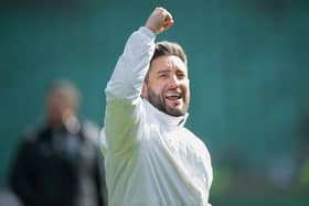 Hibs boss Lee Johnson celebrates at full time after beating Hearts