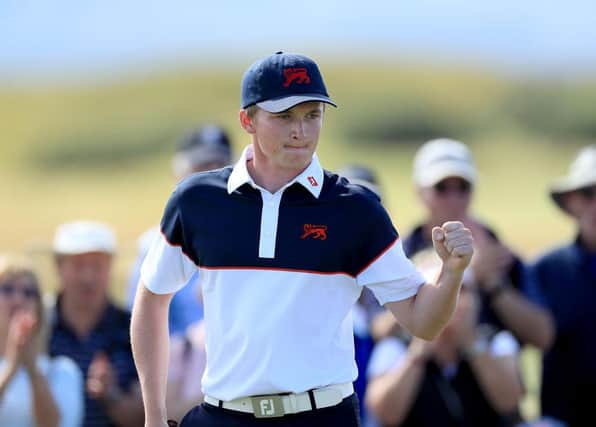 Sandy Scott of the Great Britain and Ireland team celebrates a birdie to win the first hole in his match against Brandon Wu of the US during the singles matches on the final day of the 2019 Walker Cup Match at Royal Liverpool. Picture: David Cannon/Getty Images