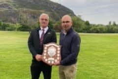 Scott Johnston, right, received his trophy after winning at Prestonfield from club captain Ian Cowan