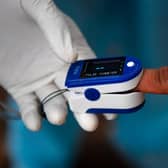 Pulse oximeters are currently being rolled out by the NHS to some Covid-19 patients across the UK (Getty Images)
