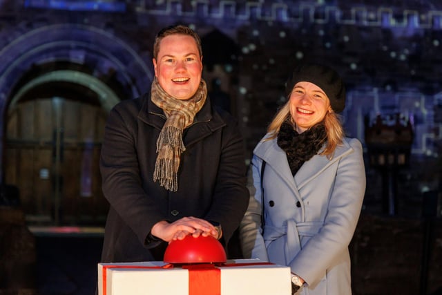 Local resident Andew Neilson joined the team behind Castle of Light to ‘switch-on’ the unique after-dark trail, after securing the coveted opportunity to light up the skyline as a winner of the Castle of Light mystery ticket trail which took place in the run up to the event. He is pictured at the switch-on with his partner.