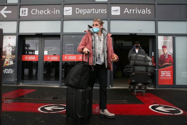 Passengers after arriving at Edinburgh airport, ahead of new quarantine rules in Scotland which mean that from Monday, travellers from any country will be forced to self-isolate in a hotel for 10 days on arrival.