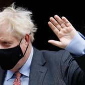 Britain's Prime Minister Boris Johnson wears a face mask due to the Covid-19 pandemic, as he leaves 10 Downing Street in central London in September 2020